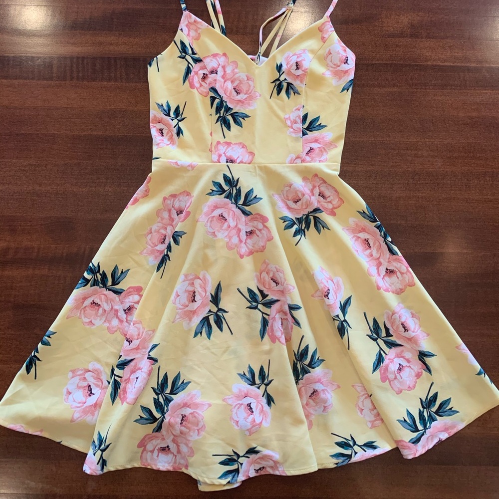 a light yellow summer dress with pink flowers